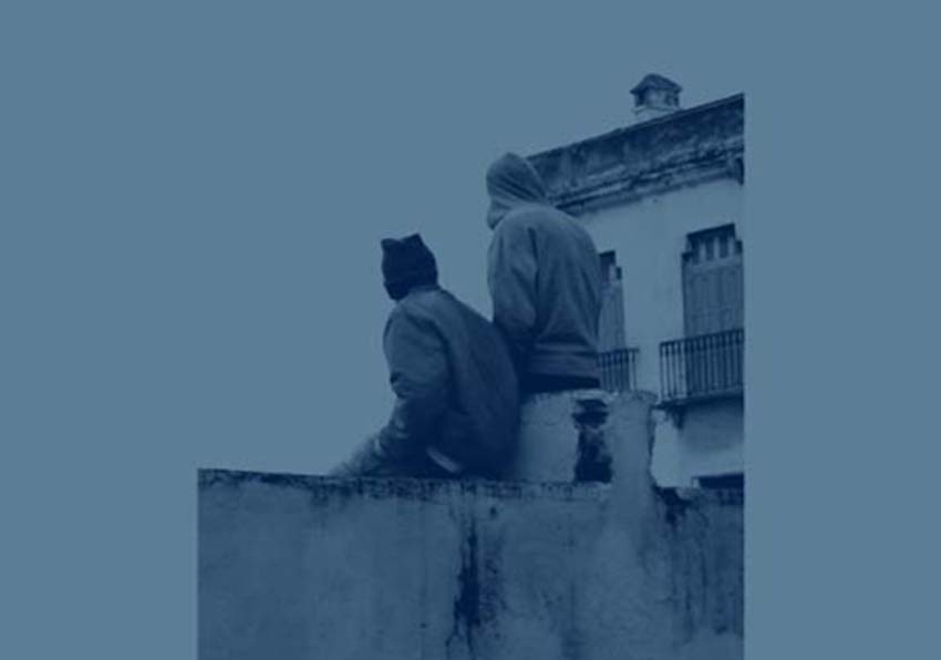 Detail of the book cover. Two people sitting on a wall